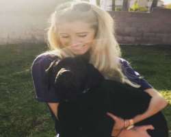 She is an animal lover and is often seen playing with them.